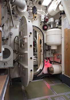 Interior of an old submarine - Limited space and lots of equipment - Door