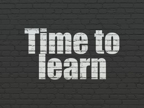 Timeline concept: Painted white text Time to Learn on Black Brick wall background