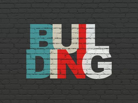 Construction concept: Painted multicolor text Building on Black Brick wall background