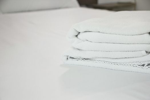 white towel on white mattress fabric, soft light in the morning