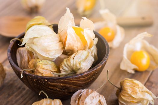 Cape gooseberry (Physalis) in wooden bowls