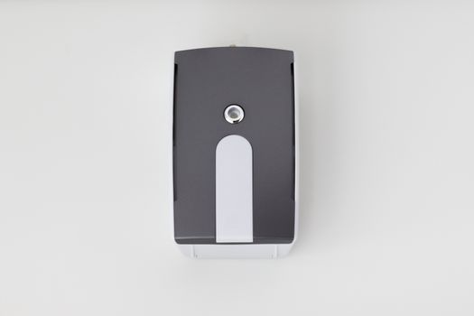 Wireless doorbell hanging on a white wall