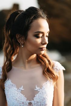 bride on the shore of the black sea in the sunset light