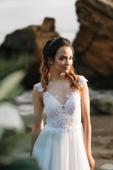 bride on the shore of the black sea in the sunset light