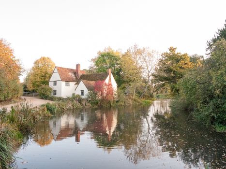 willy lotts cottage at flatford mill in suffolk in autumn reflections in lake; suffolk; england; uk