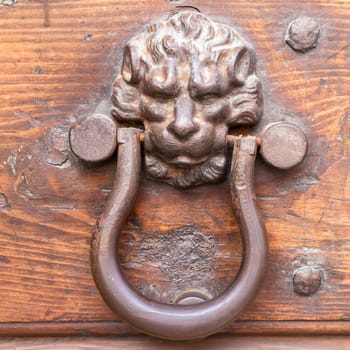 Close up of rustic old door in Spoleto, Italy.