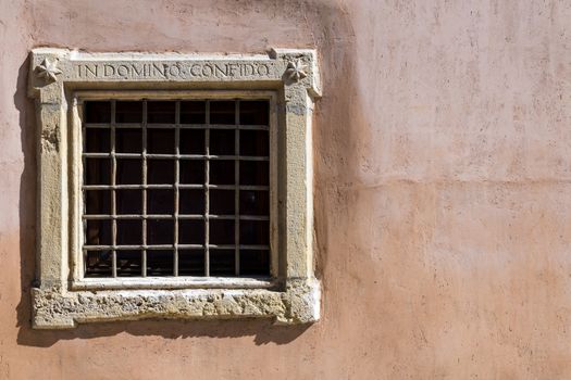 Assisi (Italy): Window on medieval stone wall
