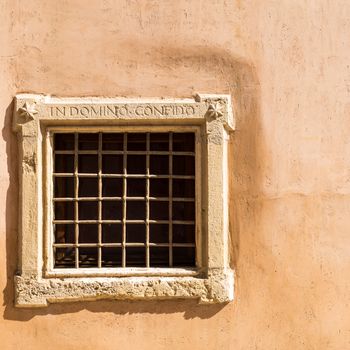 Assisi (Italy): Window on medieval stone wall