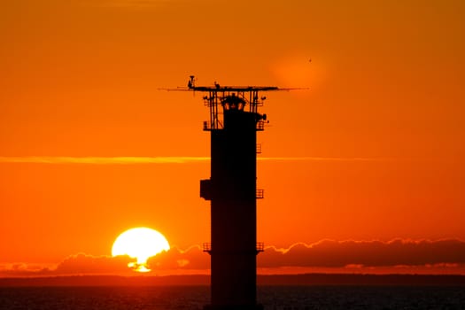 A navigational marker in a sunset in the Baltic Sea