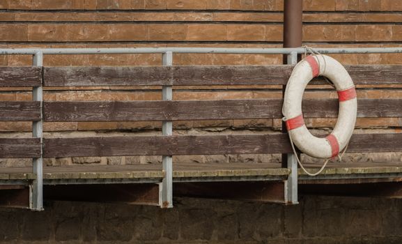 A rescue ring hangs on the bridge