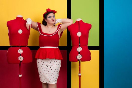 View of pinup vintage girl next to a colorful pop art backdrop.