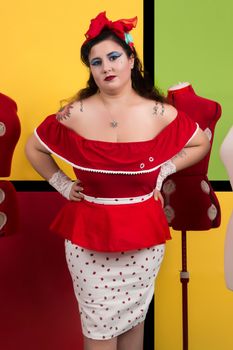 View of pinup vintage girl next to a colorful pop art backdrop.