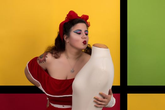 View of pinup vintage girl next to a colorful pop art backdrop.