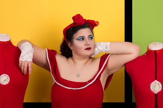 View of pinup vintage girl next to a colorful pop art backdrop.