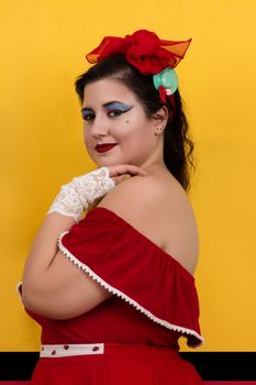 View of pinup vintage girl next to a colorful red and yellow background.