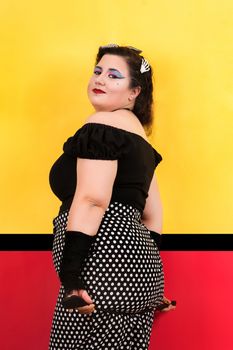 View of pinup vintage girl next to a colorful pop art backdrop.