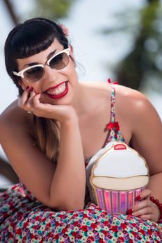 Pinup girl  with dress relaxing in the beautiful urban park.