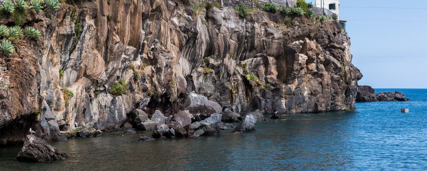 Close up view of the geological structure of the coastline in Camara de Lobos, Madeira.