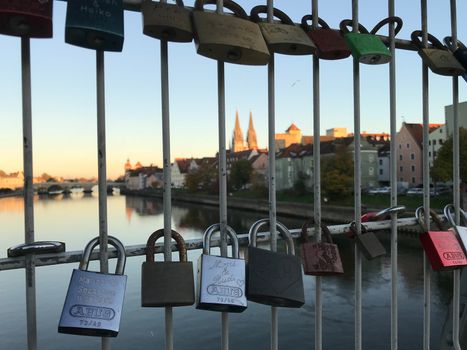 Padlocks over Danube at iron bridge in Regensburg