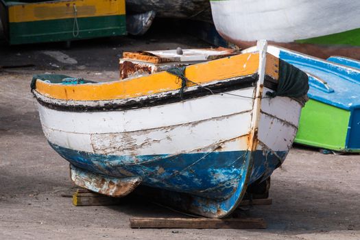 Traditional fishing boat on the shoreline of Camara de Lobos, Madeira.