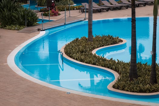 View of a beautiful swimming pool on hotel.