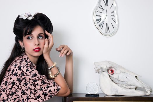 Woman posing with a vintage style retro floral clothing.