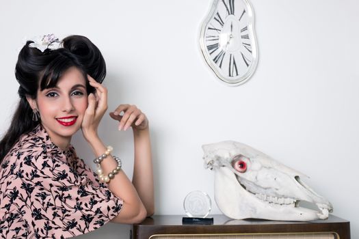 Woman posing with a vintage style retro floral clothing.