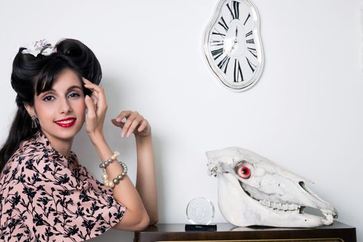 Woman posing with a vintage style retro floral clothing.