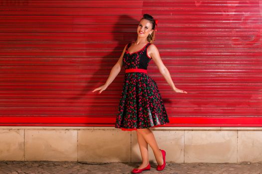 Woman posing with a vintage style retro floral clothing.