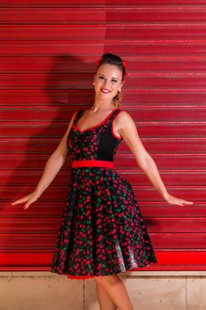 Woman posing with a vintage style retro floral clothing.