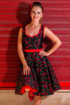 Woman posing with a vintage style retro floral clothing.