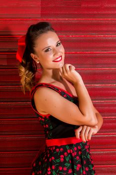 Woman posing with a vintage style retro floral clothing.