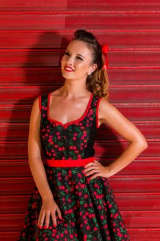 Woman posing with a vintage style retro floral clothing.