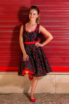 Woman posing with a vintage style retro floral clothing.