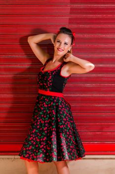 Woman posing with a vintage style retro floral clothing.