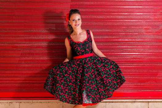 Woman posing with a vintage style retro floral clothing.