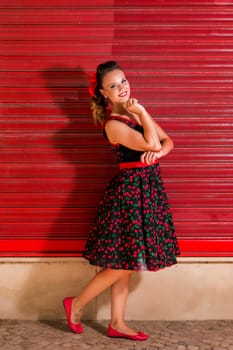 Woman posing with a vintage style retro floral clothing.