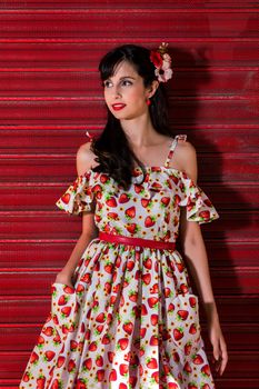 Woman posing with a vintage style retro floral clothing.