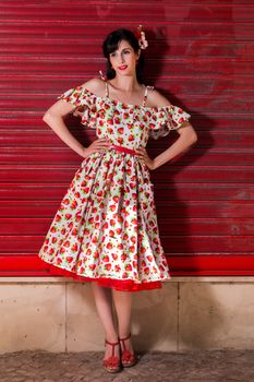 Woman posing with a vintage style retro floral clothing.