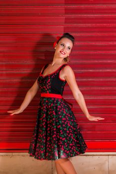 Woman posing with a vintage style retro floral clothing.