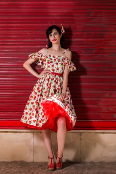 Woman posing with a vintage style retro floral clothing.