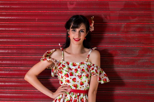 Woman posing with a vintage style retro floral clothing.