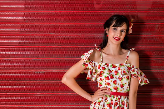 Woman posing with a vintage style retro floral clothing.