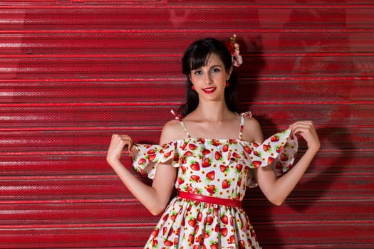 Woman posing with a vintage style retro floral clothing.