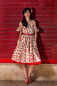 Woman posing with a vintage style retro floral clothing.