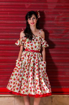 Woman posing with a vintage style retro floral clothing.