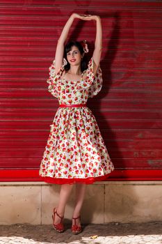 Woman posing with a vintage style retro floral clothing.