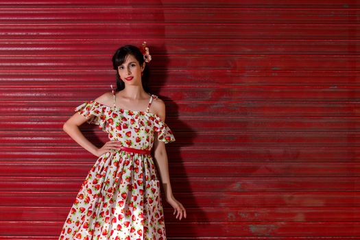 Woman posing with a vintage style retro floral clothing.