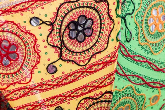 Close up view of colorful vintage design fabrics.