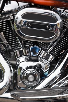Close view detail of the shiny details of a classic motorcycle.